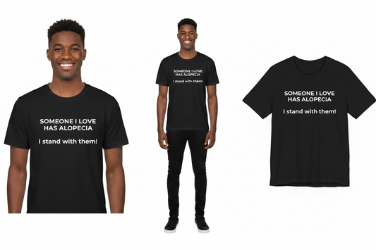 Black t-shirt with text 'Someone I love has alopecia. I stand with them!' worn by a person, displayed on a white background.