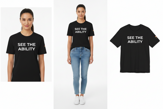 Person wearing a black t-shirt with 'See the Ability' text, standing next to a plain white background.