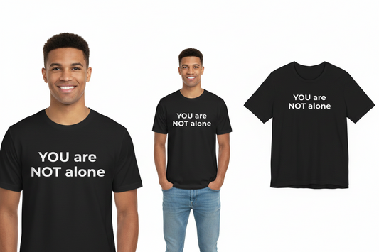 Two people wearing black t-shirts with 'YOU are NOT alone' text, one person is also holding a t-shirt with the same text.