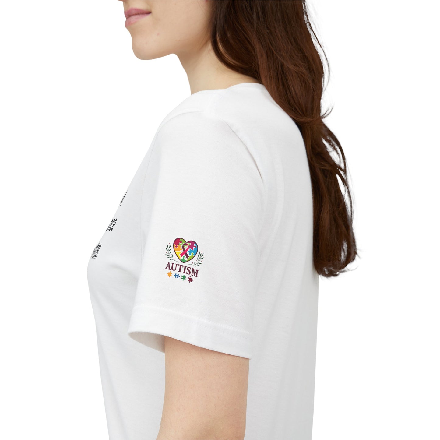 White t-shirt with autism awareness design on a plain background