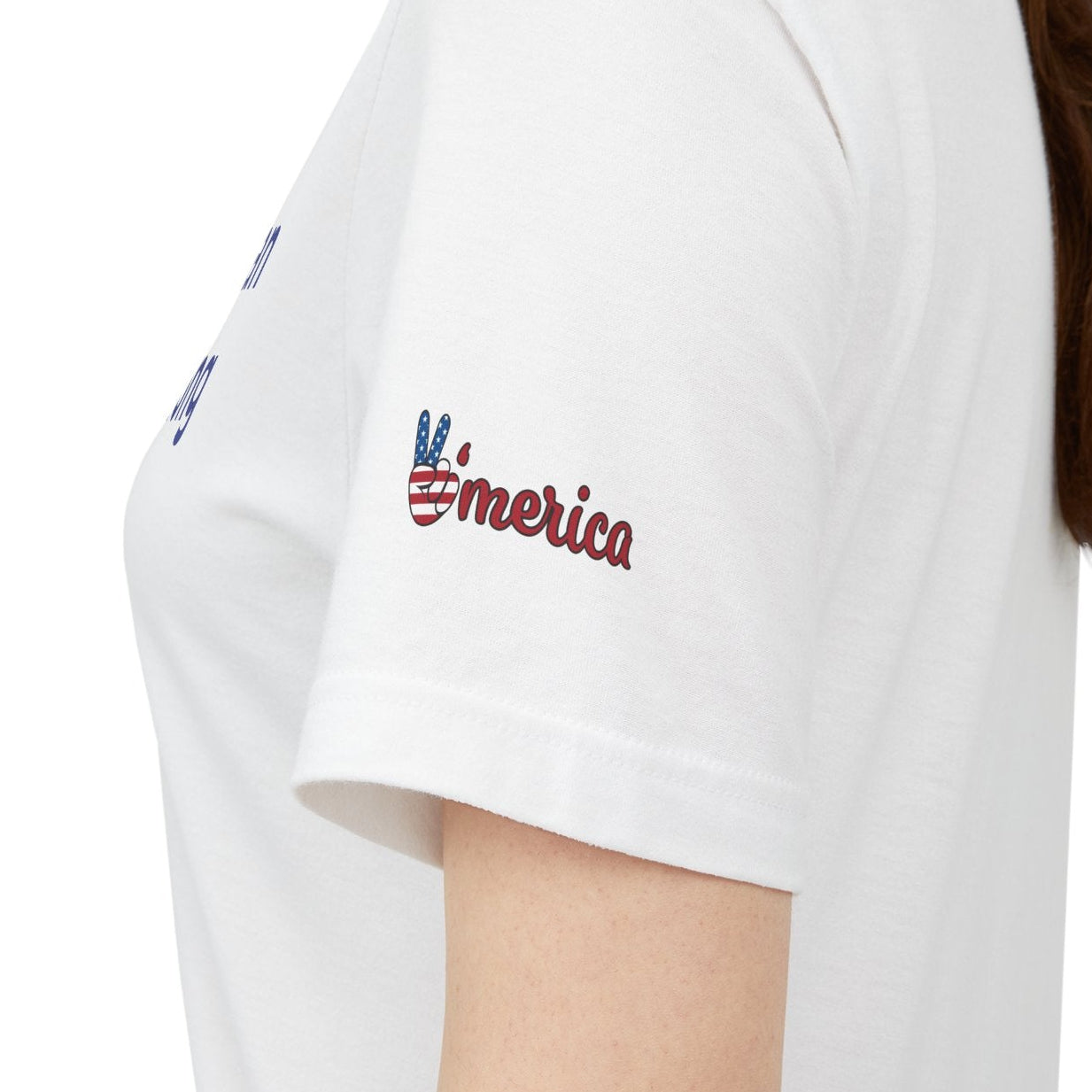 White t-shirt with a logo on the sleeve worn by a person